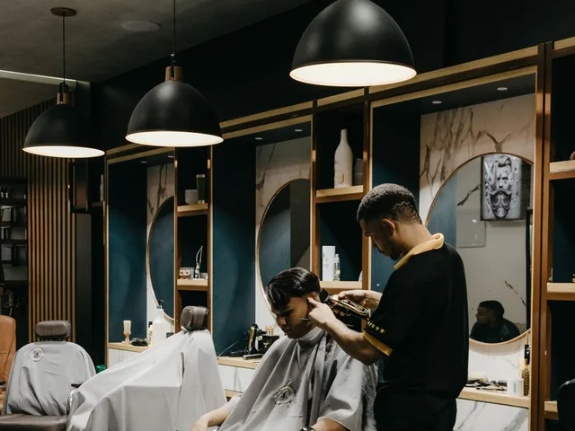 Stylist giving a haircut to a client