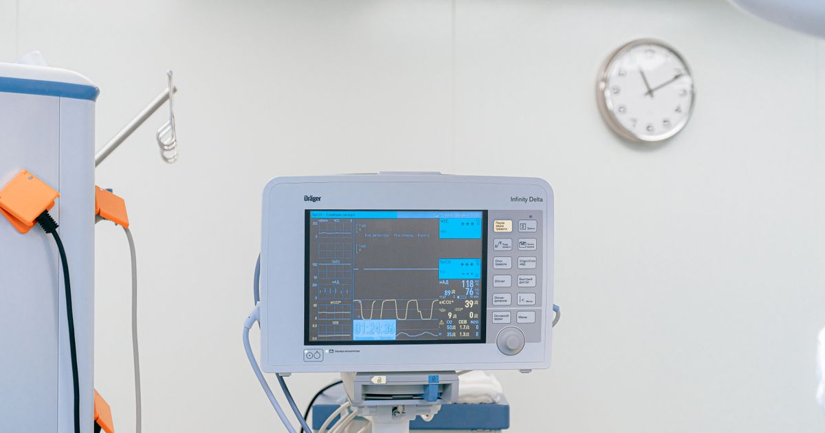 eye care: patient checking in at a clinic reception desk before a consultation