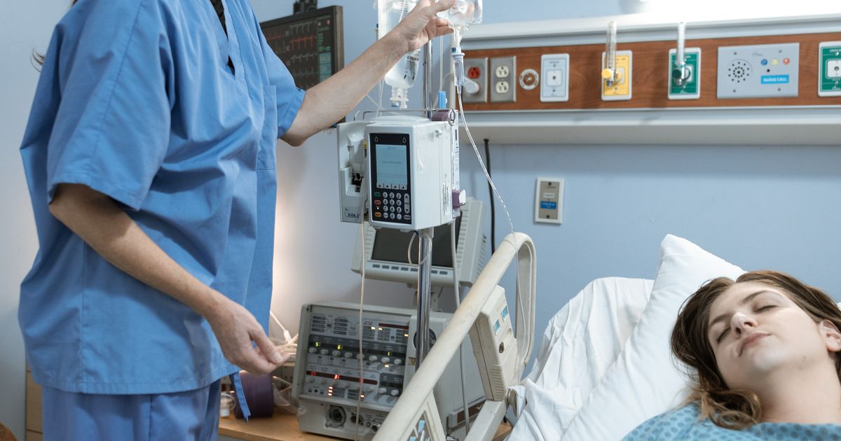 pain clinic: doctor reviewing daily schedule on a tablet