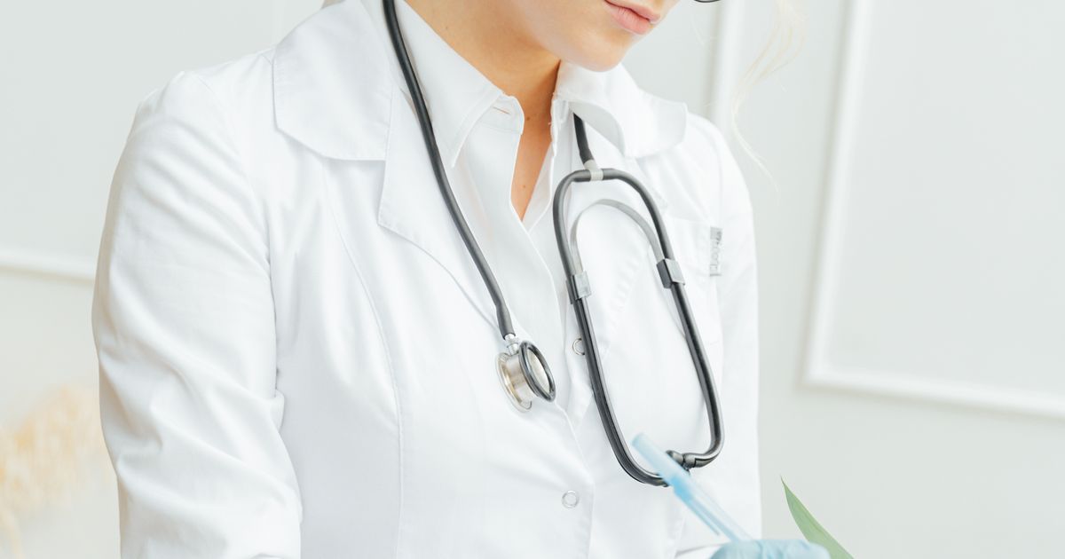 pharmacy appointment booking: customer collecting a reserved medicine pickup at the counter