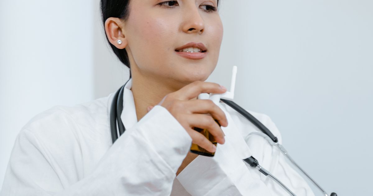 Patient scanning a QR code at a clinic entrance to join the digital patient queue in India
