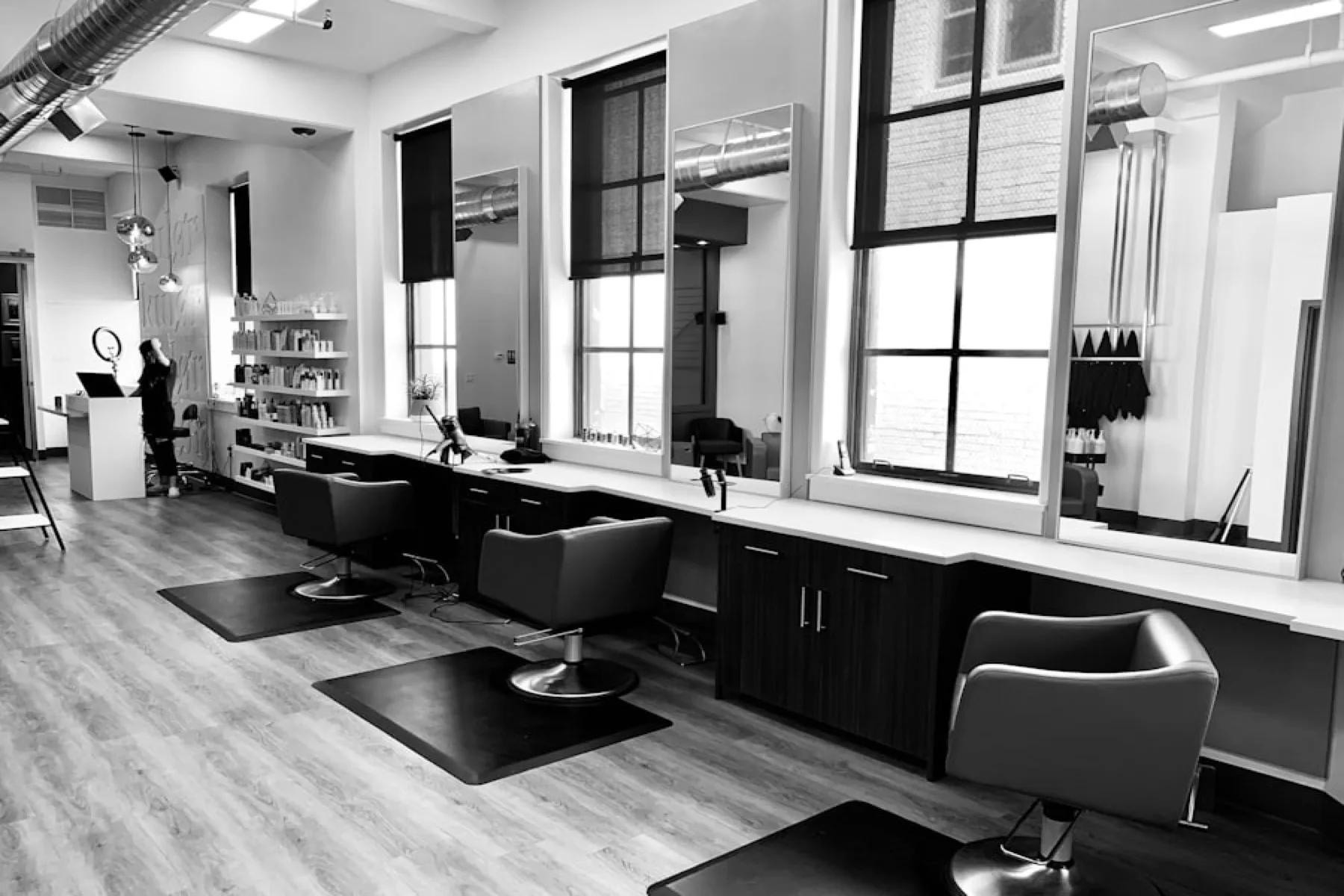 Indian salon owner using SWIQ booking software on tablet